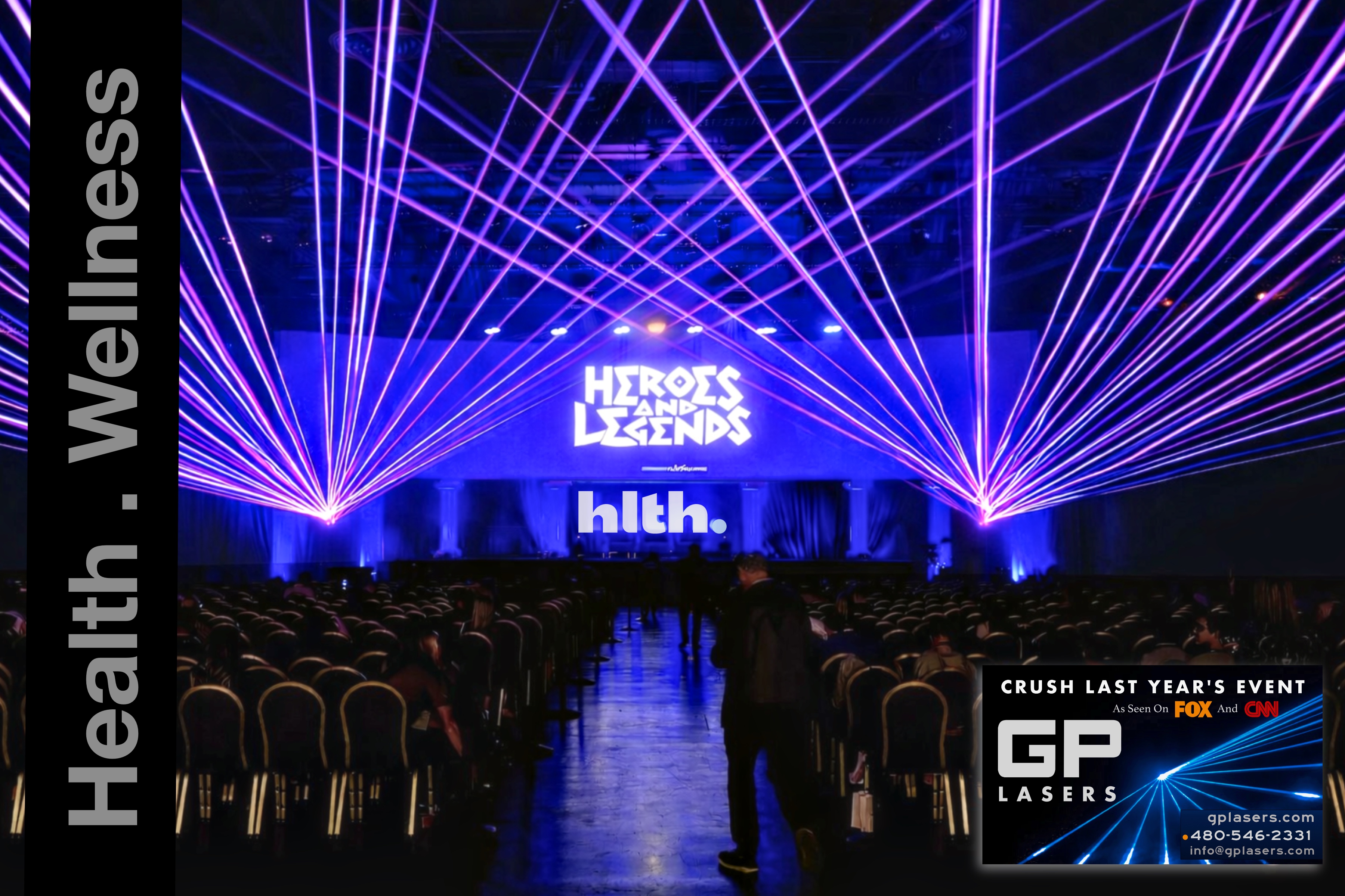 Purple and blue laser beams framing the HLTH Heroes and Legends stage