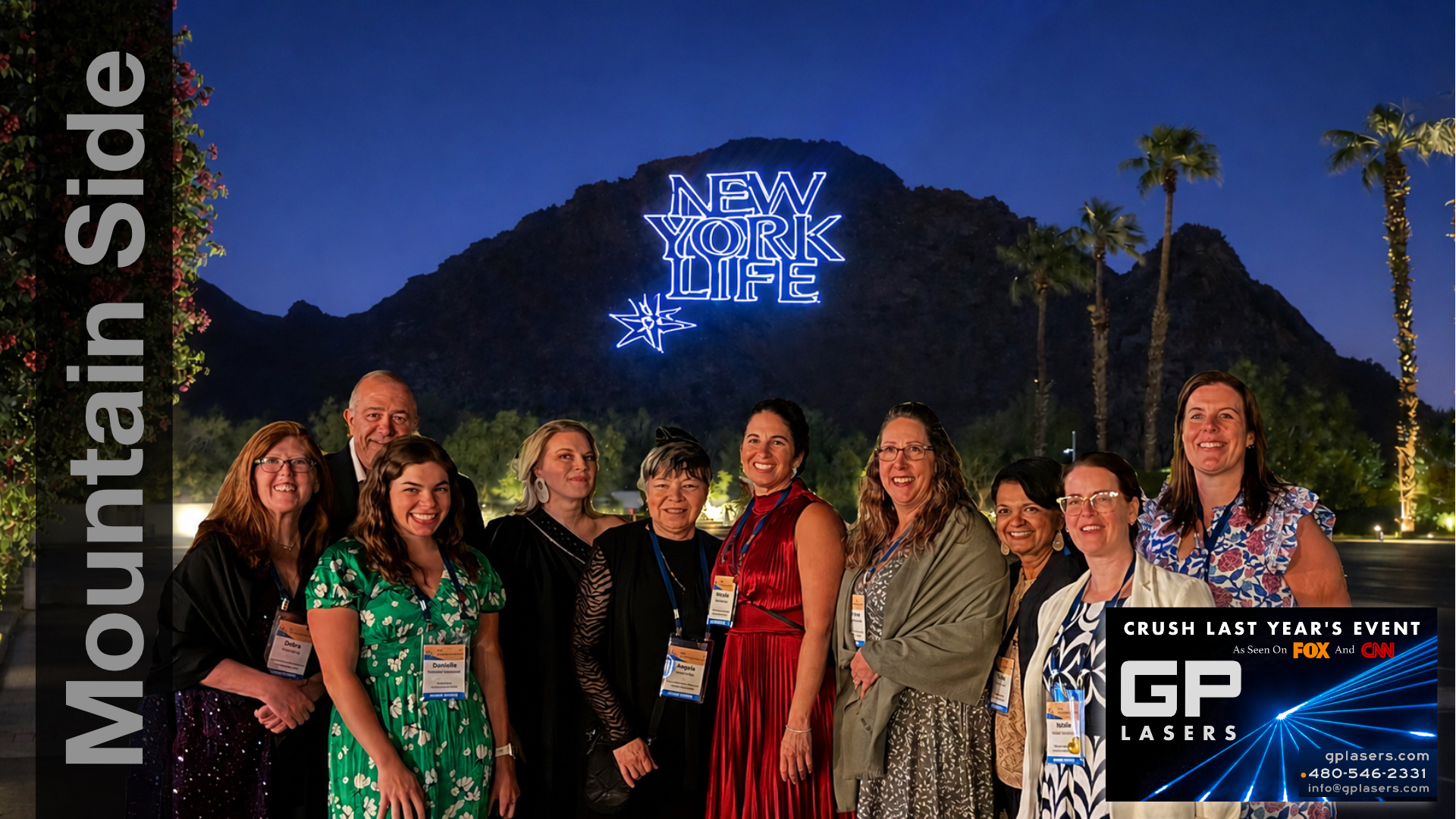 New York Life logo displayed on a mountainside behind event guests